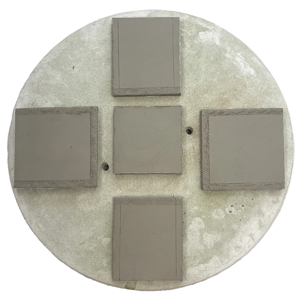 Slab built ceramic box drying on a bat