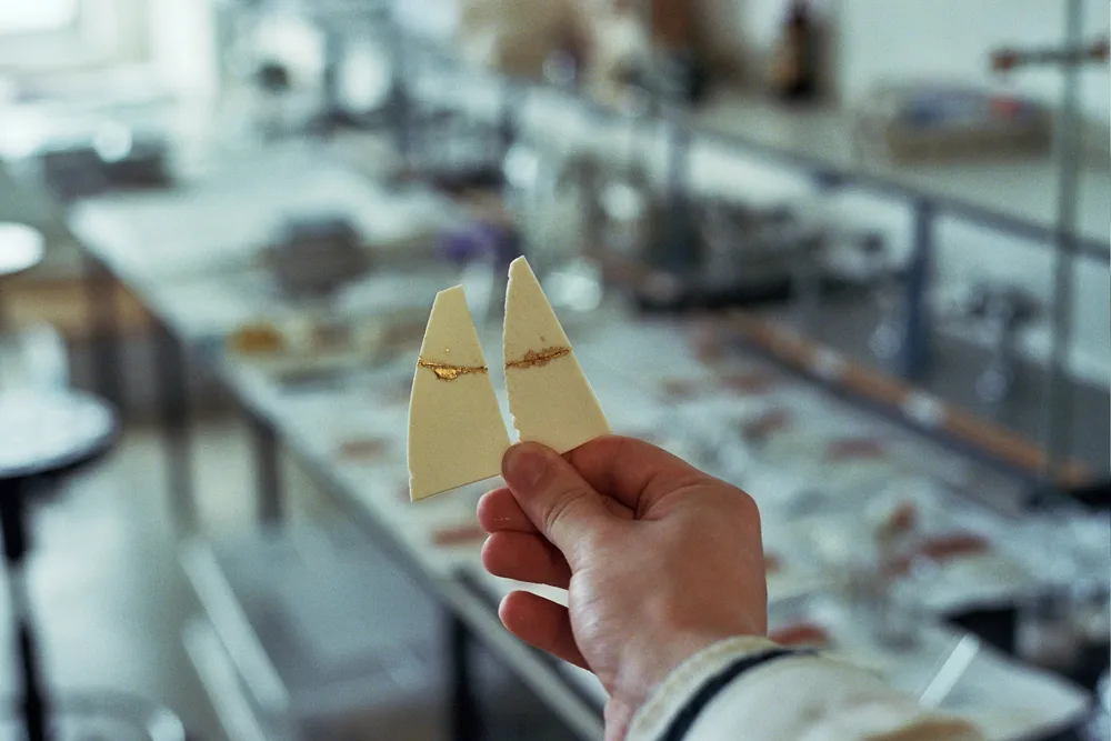 Gilt ceramic cement sample made by Tomas Brown.