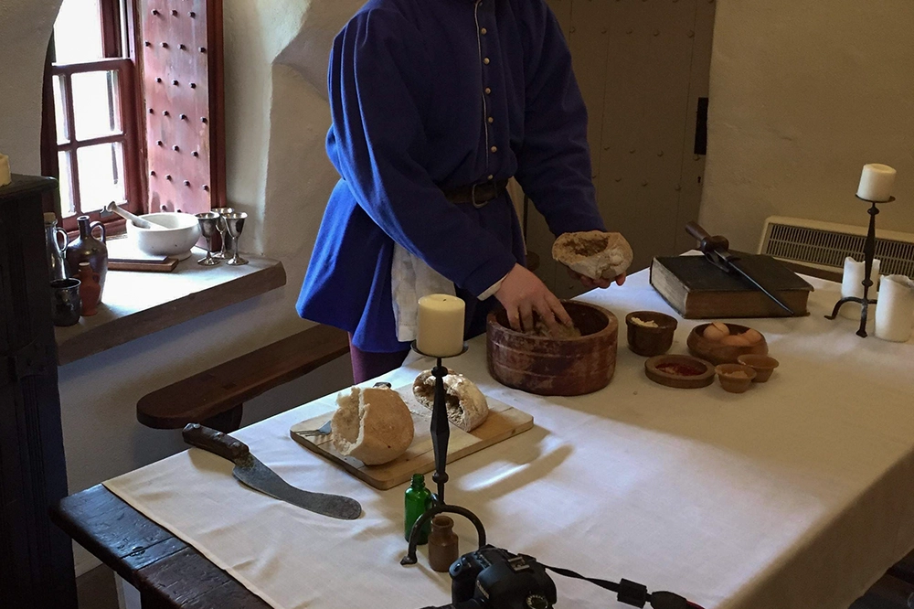 Tomas Brown working in the kitchen on medieval recipes for FEAST, 2019