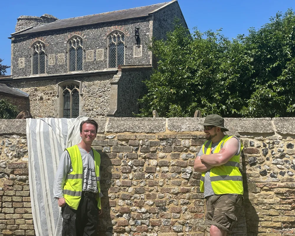 Section of flushwork boundary wall at St Nicholas' Church, Feltwell, after repointing with hot-lime mortar by Tomas Brown