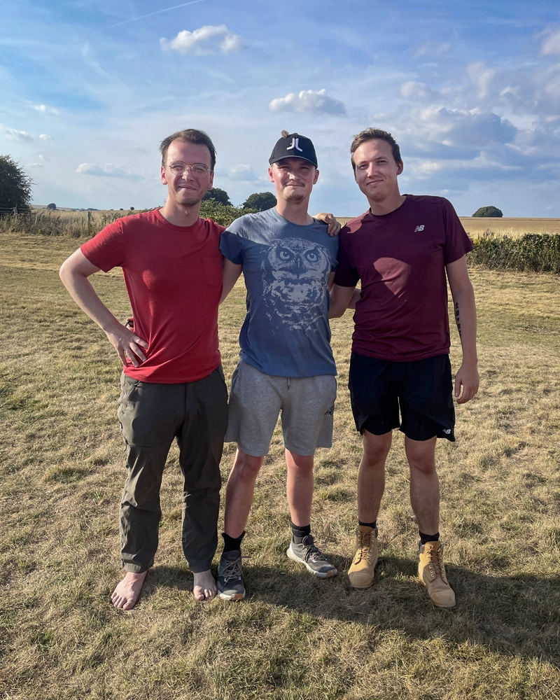 Tomas Brown and friends at the finish of the Ridgeway at Avebury, Wiltshire